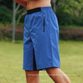 Nuevos pantalones cortos de culturismo pantalones cortos de cintura elástica pantalones cortos de ropa deportiva con pantalones cortos deportivos de bolsillo para hombres